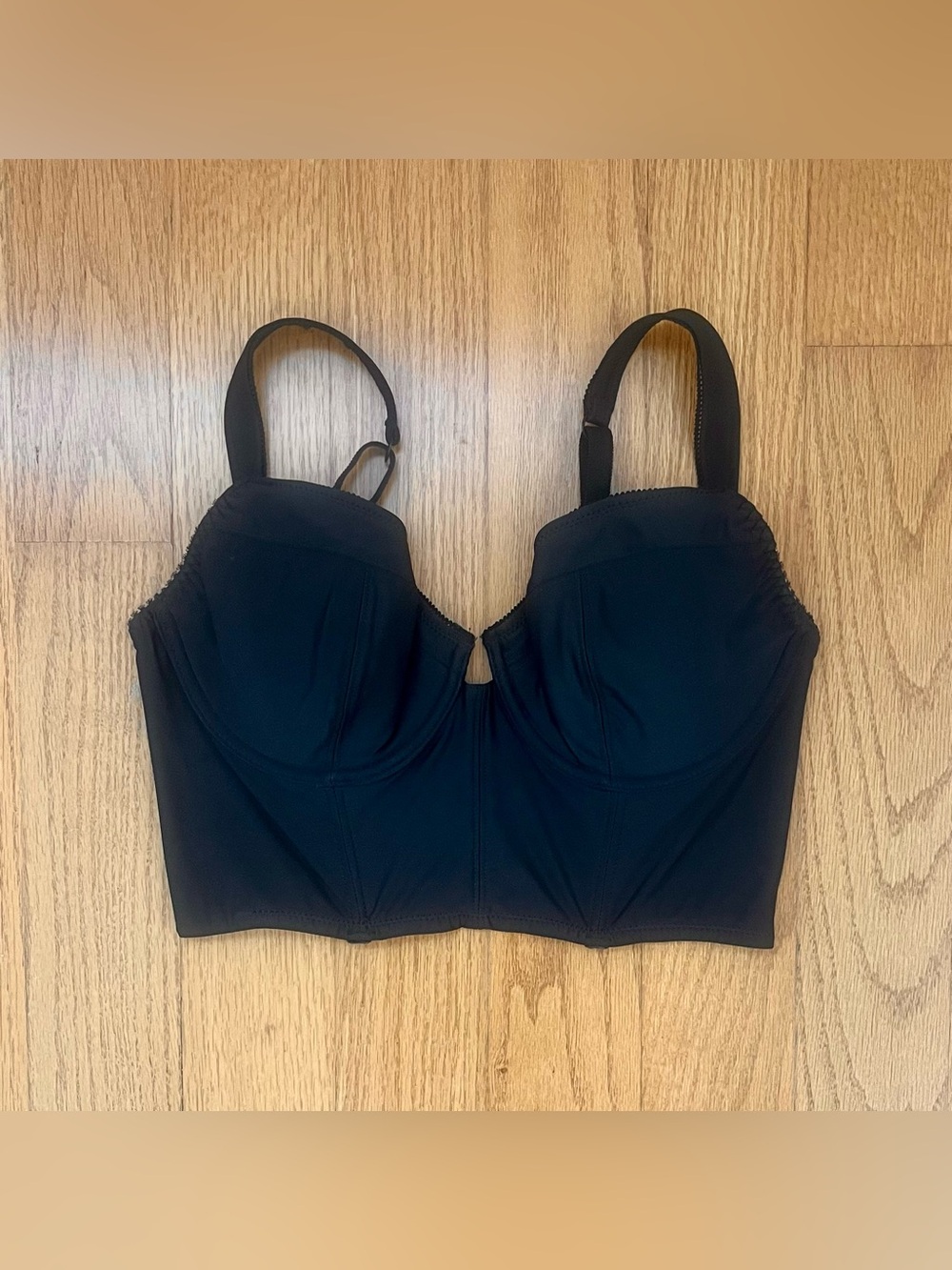 Out from under black corset top, size L